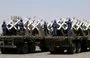 
Houthi fighters stand on a missile carrier during a September 21, 2023 military parade in Sanaa. [Mohammed Huwais/AFP]        