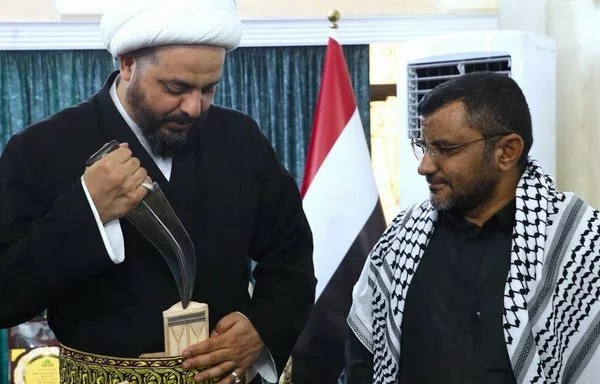 Houthi representative in Baghdad Abu Idris al-Sharafi (R) meets with Qais al-Khazaali, the leader of Iran-aligned Iraqi militia Asaib Ahl al-Haq, on July 21. [Photo circulated on X]