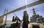 
Gunner's mates stand watch aboard the USS Carney while transiting the Suez Canal on April 6. [US Navy]        