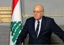 
Lebanon's caretaker prime minister Najib Mikati takes part in a press conference at the government palace in Beirut on October 18. [Anwar Amro/AFP]        