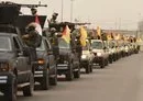 
Fighters from the Iran-backed Iraqi militia Sayed al-Shuhada, which operates in the Iraq-Syria border region, exhibit their weaponry during a rally, in a photo posted on X on April 9, 2020.        