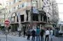 
People inspect the damage at the site of an air strike that targeted a branch of Al-Qard al-Hassan in Tyre, Lebanon, October 21. [Bilal Kashmar/AFP]        