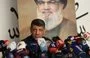 
Hizbullah spokesman Mohammed Afif speaks at a news conference. He died November 17. [Anwar Amro/AFP]        