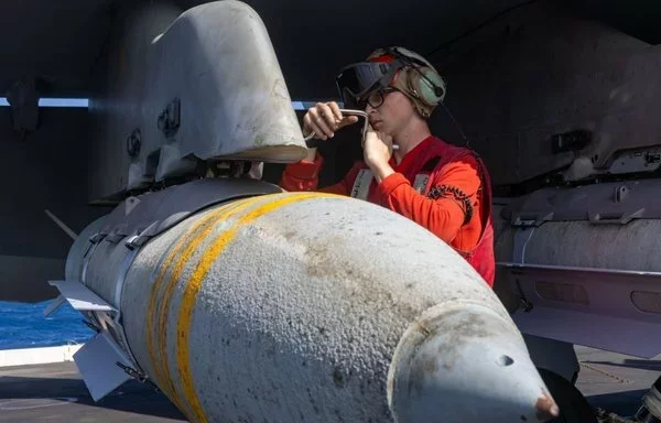 Sailors aboard the USS Harry S. Truman prepare ordnance for strikes against Houthi targets in Yemen. [CENTCOM]