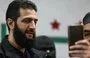 
A man takes a picture with his mobile phone of Syria's de facto new leader, Ahmed al-Sharaa, previously referred to as Abu Mohammed al-Joulani, on March 12, 2024. [Omar Haj Kadour/AFP]        