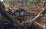 
A destroyed vehicle is seen near the Syrian city of Idlib on September 20, 2021, the same day the US military said it had killed an al-Qaeda official in a drone strike. [Omar Haj Kadour/AFP]        