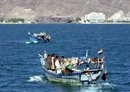 
Yemeni fishermen are seen off the coast of Aden, opposite the city's trade free zone, in May 2006. [Khaled Fazaa/AFP]        