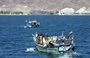 
Yemeni fishermen are seen off the coast of Aden, opposite the city's trade free zone, in May 2006. [Khaled Fazaa/AFP]        