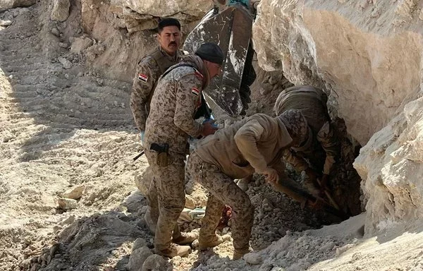 Iraqi forces inspect an ISIS hideout destroyed by an airstrike near Rawa in western Iraq on February 13. [Joint Operations Command]